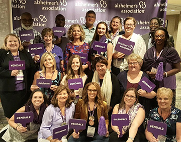 Advocates with ENDALZ signs