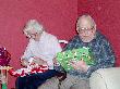 Mary and Carmen open gifts