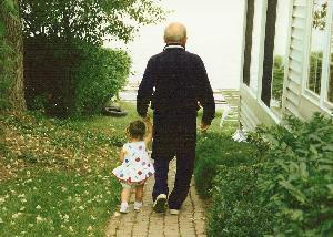 Dad (Bill Morris) at his beloved home on Canandaigua Lake, with his granddaughter Caroline.