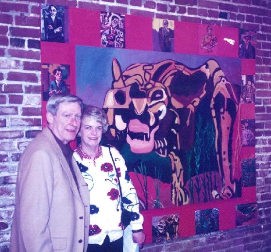 Mom and Dad, with one of Mom's paintings